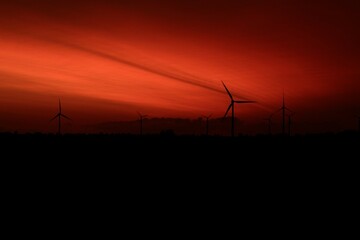 Fototapeta na wymiar Landscape with windmills in the sunset 