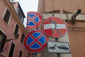 Rome, Italy: quirky street art by French street artist, Clet, on a no entry road sign in...