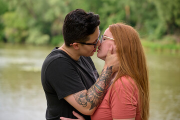 Female about to kiss her same sex partner.