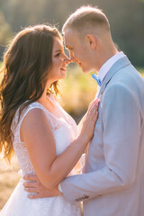 Happy newlyweds look at each other in love for a walk.