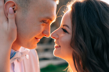Newlyweds hug on a walk on their wedding day. Close-up of lovers.