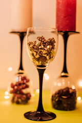 Composition of glasses, candles and decorative elements. New Year's mood