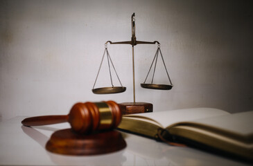 Business and lawyers discussing contract papers with brass scale on desk in office. Law, legal...