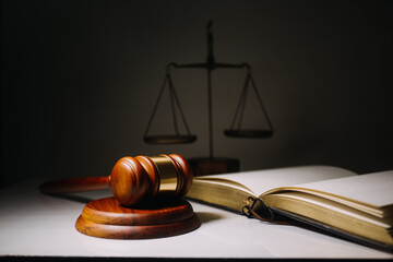 Business and lawyers discussing contract papers with brass scale on desk in office. Law, legal...
