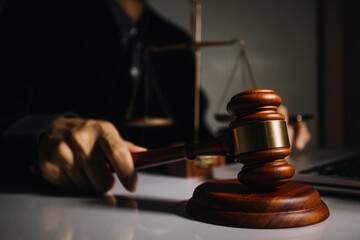 Obraz premium Business and lawyers discussing contract papers with brass scale on desk in office. Law, legal services, advice, justice and law concept