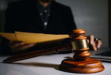 Business and lawyers discussing contract papers with brass scale on desk in office. Law, legal...