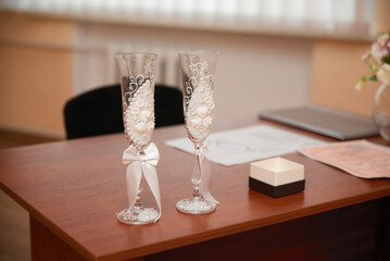 Photo of decorated wedding glasses