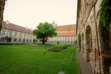 Courtyard with peacocks of Benedictine monastery in Rajhrad., Czech Republic.