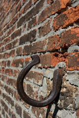 
old horseshoe in the wall