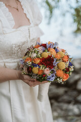 Bride with a flower bouquet in her hand - 548318423