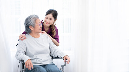 Medical staff taking and caregiver senior woman in Home. Home care concept.