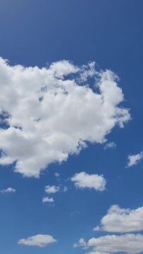blue sky with white clouds vertical video social media background 