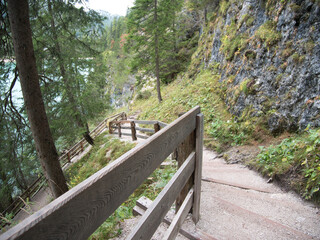 Fototapeta na wymiar On the trails around Braies Lake in the fall. Dolomites, Italy.