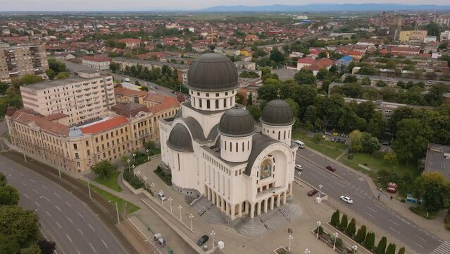 Aerial view of the Orthodox cathedral in Arad, Romania. The Church was shot from a drone while flying around keeping it in the focus with the camera tilted downwards for a top view shot.