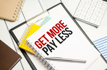 get more pay less . Conceptual background with chart ,papers and pen