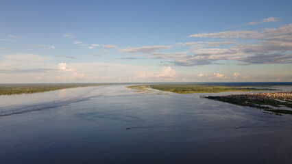 Drone view of the immensity of the Amazon River with two ships as scale of the magnitude