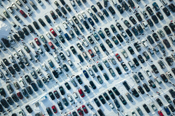 Aerial view of many cars parked for sale and people customers walking on car market or parking lot...
