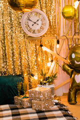 Christmas photo zone with a Christmas tree, garland, New Year's decor and gifts. Christmas and New Year celebration concept.