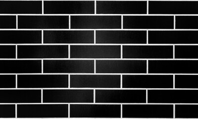 Style wall of black tile or brick with white seams. Brick wall texture for background. Copy space....
