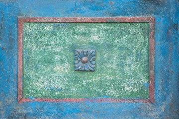 Detail of iron garden gate with ornaments closeup as color background