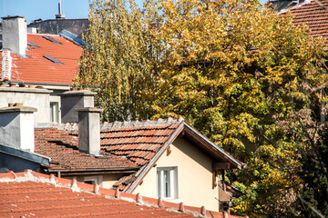 Fototapeta na wymiar Roofs of townhouses covered with ceramic tiles