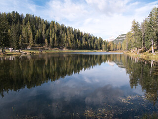 A sunny autumn day along Lake Antorno, Dolomites, Italy.