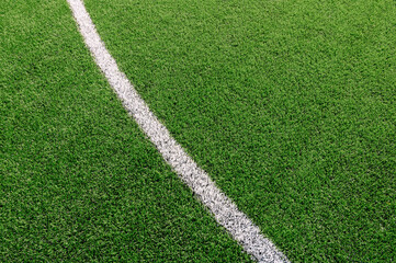 Texture of Perfect green lawn on the football field