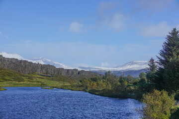 Thingvellir National Park, Iceland: Original site of the Althing (General Assembly) and snow-covered mountains in the distance.