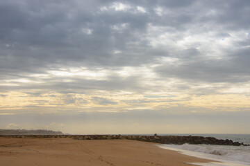 Beautiful sandy beach in Quarteira, Algarve, southern Portugal at the end of the day