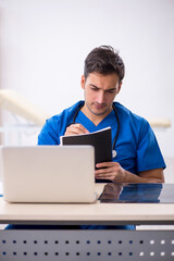 Young male doctor working in the clinic