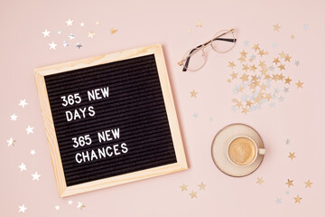 365 new days, 365 new chances. Letter board with motivational quote on pink background. New year...