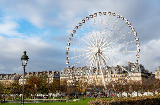Big Ferris wheel (Grande roue de Paris) at the Jardin des Tuileries in Paris. Shot in autumn on a cloudy day.
