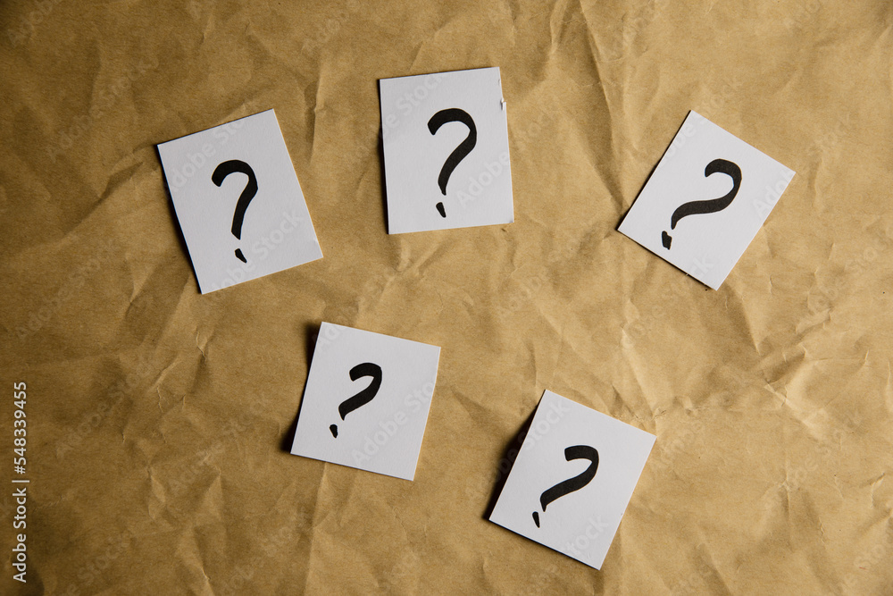 Poster papers with a question mark