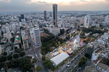 Aerial drone cityscape of nicosia capital city of cyprus.  Amusement park at Christmas
