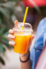 orange juice in the hand
