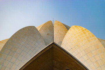 Characteristic architecture of the lotus temple where people go on pilgrimage to pray in New Delhi