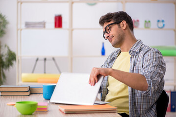 Fototapeta premium Young male freelancer working from home