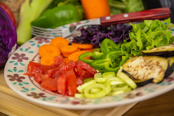 Porcelain plate with sliced vegetables.