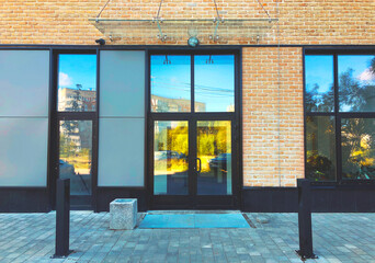 Modern real estate, residential apartment building, entrance with glass canopy and door