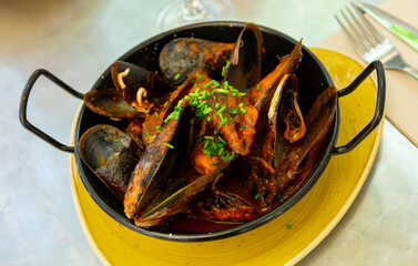 Popular dish of Spanish cuisine is mussels a la Marinera
