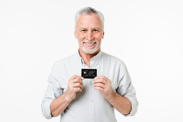 Happy caucasian mature man client customer holding credit card for online payment shopping cashback loan pension isolated in white background