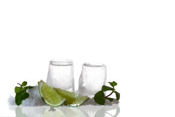 ice shots with lime on white background