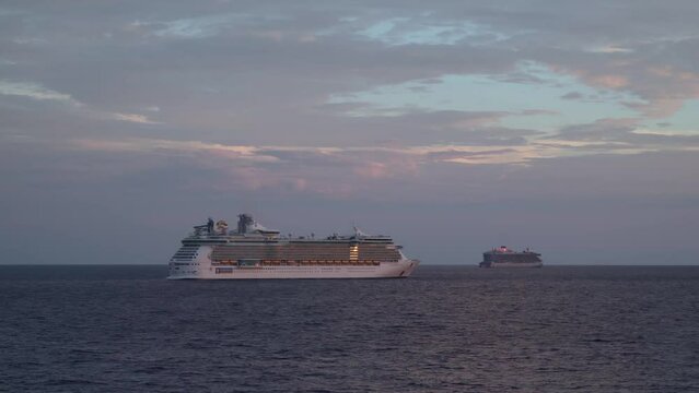 Eve of sunrise. Cruise ship anchored. Morning twilight at ocean