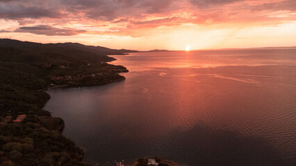 Photos with drone of the sunset on the coast of the Gulf of Cariaco in the Sucre State. You can see the beaches, coasts, hills and buildings, hotels, residential complexes, Gulf of Cariaco, waves, nea