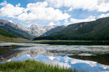 Naklejka na ściany i meble Mountains reflected in a lake