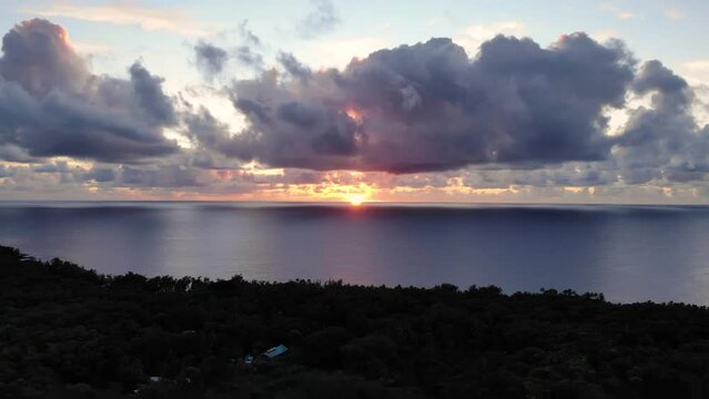 Timelapse of a sunrise on Hilo island, Hawaii with light purple clouds