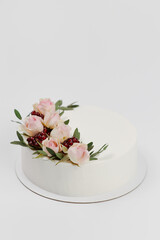 white wedding cake decorated with flowers
