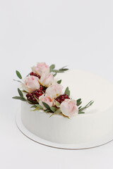 white wedding cake decorated with flowers