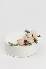 white wedding cake decorated with flowers