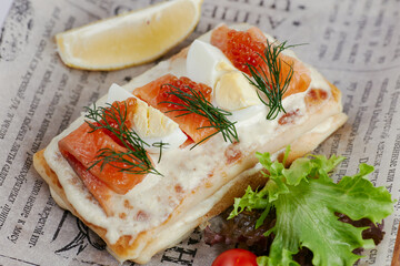 pancakes with vegetables and red fish